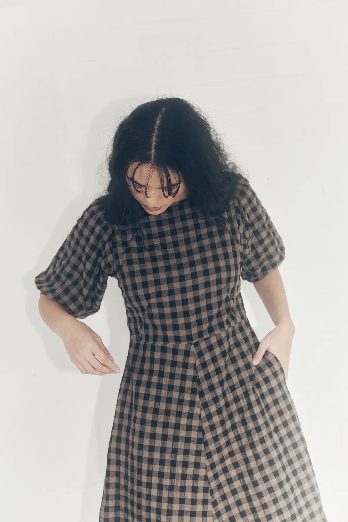 model standing in a line gingham dress colour mocha and black