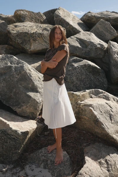 Cool girls at the beach wearing brown tshirt 